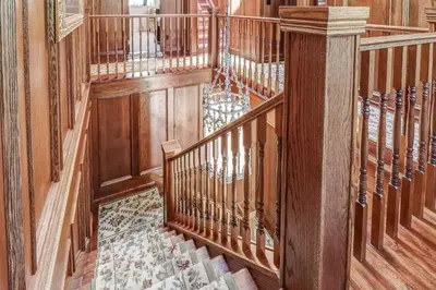 an overhead view of a wooden staircase in a house at School House Bed and Breakfast C.1859 in Niagara on the Lake