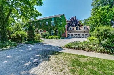 an estate with a large house and a driveway at School House Bed and Breakfast C.1859 in Niagara on the Lake