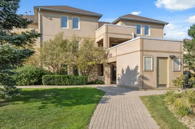 a house with a driveway in front of it at 3 Bedroom Mountain Walk Condo, Steps to Village in Blue Mountains