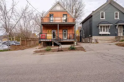 a house on the side of a street at ENTIRE 1 BEDROOM APARTMENT ACROSS FROM GOOGLE - br5 in Kitchener