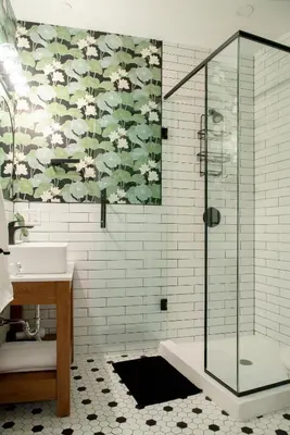 a bathroom with a shower and a sink at The Juniper Inn in St. Catharines