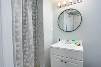 a bathroom with a sink and a mirror at Wintergreen Retreat with Private Sauna & Patio 82291 in Blue Mountains