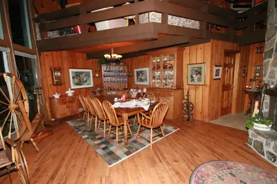 a dining room with a table and chairs at Stouffermill Bed & Breakfast in Algonquin Highlands