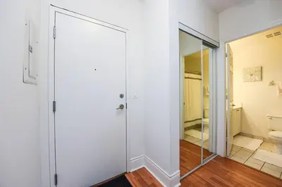 a bathroom with a toilet and a glass door at PlanURstay - Amazing 2BR & 2BTH - Near Square One Mall in Mississauga
