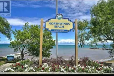 a sign that says northimuls beach on a beach at Blue Mountain Studio Oasis in Blue Mountains