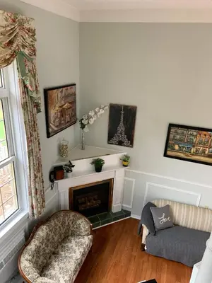 a living room with a fireplace and a couch at The Jypsy Inn Chambre Damour Bracebridge in Bracebridge