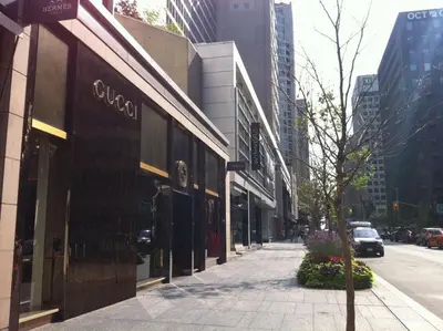 a city street with tall buildings and a tree at Stylish Downtown Toronto Residential Hotel in Toronto