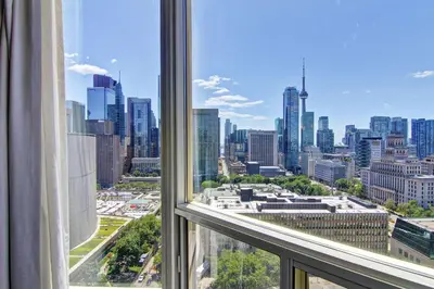 a view of a city skyline from a window at DoubleTree by Hilton Toronto Downtown in Toronto