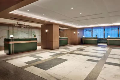 a lobby of a hotel with a check in counter at Sheraton Centre Toronto Hotel in Toronto