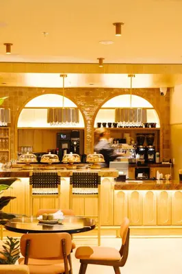 a restaurant with tables and chairs and a counter at Union Hotel in Toronto