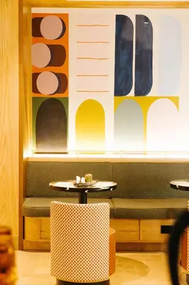 a dining room with a table and a bench at Union Hotel in Toronto