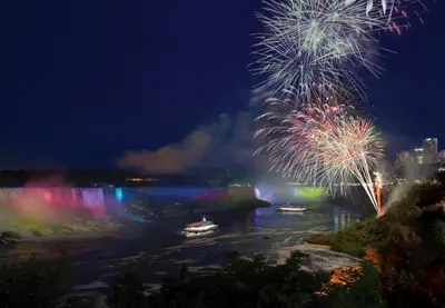 a firework display over the niagara river at night at Tower Hotel at Fallsview in Niagara Falls