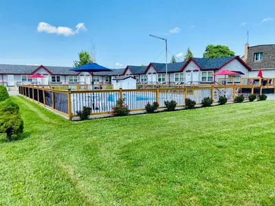 a fence in front of a row of houses at A1 Inn Niagara Falls in Niagara Falls