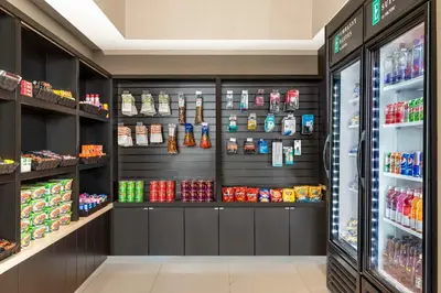 a retail store with black walls and shelves at Embassy Suites By Hilton Toronto Airport in Toronto