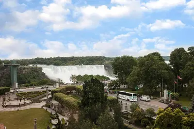 a view of a large waterfall in a city at Sheraton Fallsview Hotel in Niagara Falls