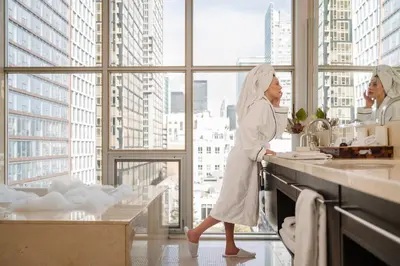 two women standing in a kitchen preparing food at SoHo Hotel Toronto in Toronto