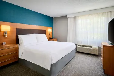 a hotel room with a large bed and a window at TownePlace Suites by Marriott Mississauga-Airport Corporate Centre in Mississauga