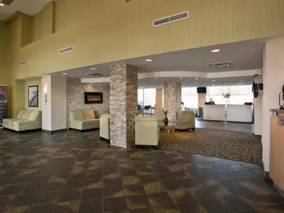 a lobby with couches and chairs in a building at The Oakes Hotel Overlooking the Falls in Niagara Falls