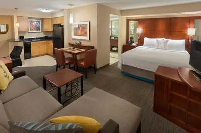 a hotel room with a bed and a living room at Residence Inn by Marriott Toronto Downtown / Entertainment District in Toronto