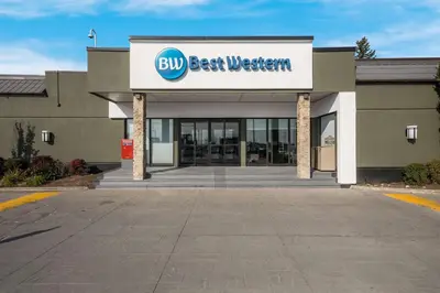 a building with a sign for a big best western at Best Western Parkway Hotel Toronto North in Richmond Hill