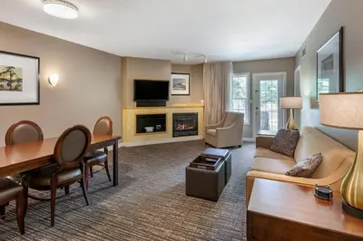 a living room with a couch and a table at Carriage Ridge Resort, an Ascend Collection Resort in Oro-Medonte
