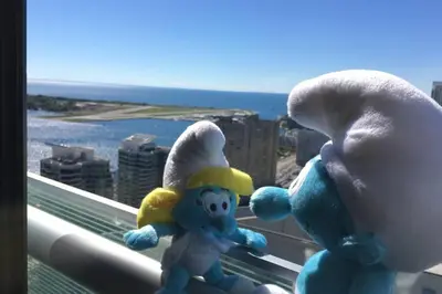 two stuffed animals sitting on a window sill at Magnificient View next CN Tower/Rogers/Union/MTCC in Toronto