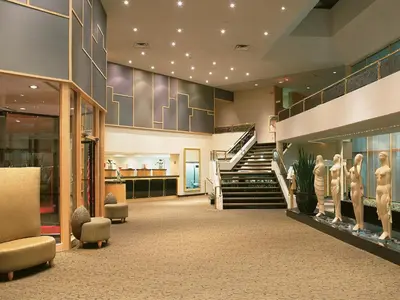 a large lobby with a staircase and a museum at White Oaks Conference & Resort Spa in Niagara on the Lake