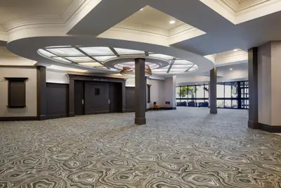 a large ballroom with a coffered ceiling and a large room with a large at Holiday Inn Hotel & Suites St.Catharines-Niagara by IHG in St. Catharines