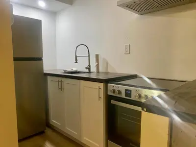 a kitchen with a sink and a stove at Ranch House Inn in Exeter