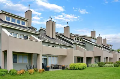 an exterior view of a large building with grass at Wintergreen 119 in Blue Mountains