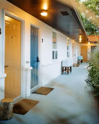 a hallway of a house with a blue door at Penny's Motel in Thornbury