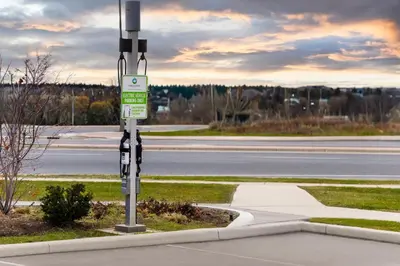 a pole with a sign on it next to a street at avid Hotel - Toronto - Vaughan Southwest by IHG in Vaughan