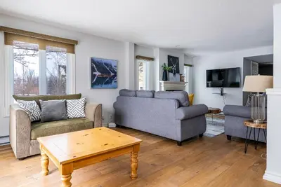a living room with two couches and a coffee table at Luxurious Blue Mountain 3BR & 3BTH Walk-in to Village in Blue Mountains