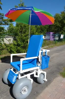 a wheelchair with a colorful umbrella sitting on the street at Oasis by the Bay Vacation Suites in Wasaga Beach