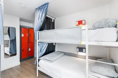a room with two bunk beds and a hallway at Samesun Toronto in Toronto