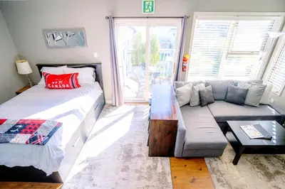 a living room with a bed and a couch at Hillside BLUE MTN Family Loft @ North Creek Resort in Blue Mountains