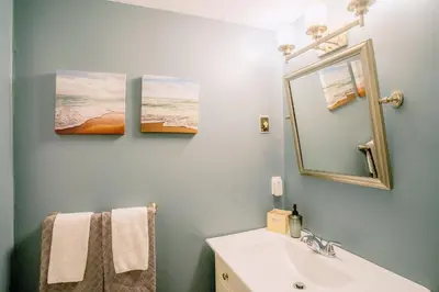 a bathroom with a sink and a mirror at Updated Blue Mountain Studio @ North Creek Resort in Blue Mountains