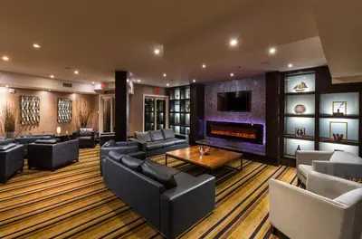 a large living room with couches and a fireplace at Living Water Resort & Spa in Collingwood