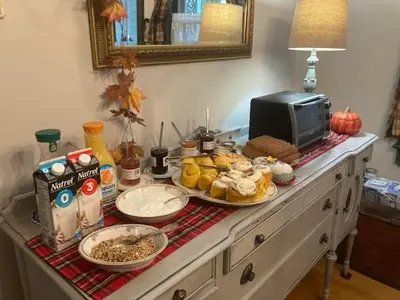 a buffet with plates of food on a table at Bristows Inn in Elmira