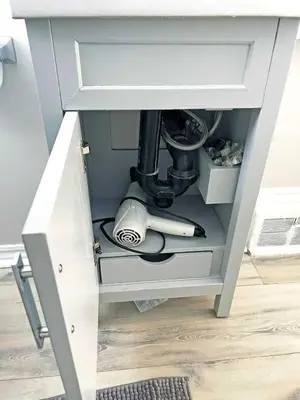 a drawer in a desk with a microscope at Hamilton Chic Retreat - Comfy Beds - Garden - Pool in Hamilton