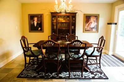 a dining room with a table and chairs at Sapience Retreat & Apothecary in Niagara on the Lake