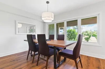 a dining room with a wooden table and chairs at Lovely 3 Bedroom Wintergreen Retreat w Sauna in Blue Mountains