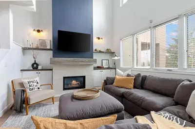 a living room with a couch and a fireplace at Luxury Blue Mtn Getaway w Indoor Sauna in Blue Mountains
