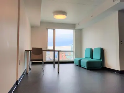 a room with a table and two chairs and a window at Toronto Metropolitan University-Daphne Cockwell Complex Residence in Toronto