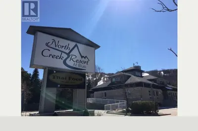 a sign for a north creek katy motel at Freshly Upgraded Cozy Loft @ North Creek Resort in Blue Mountains