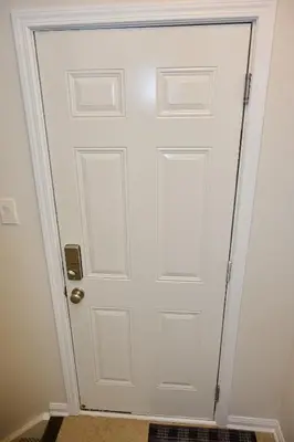 a white door with a gold door knob at Peace Alcove in Milton