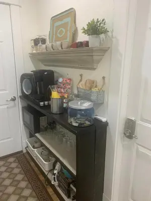 a small black refrigerator in a kitchen with food at Villa di Casa - Boutique Hotel in Wellington