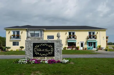 a building with a sign in front of it at Villa di Casa - Boutique Hotel in Wellington