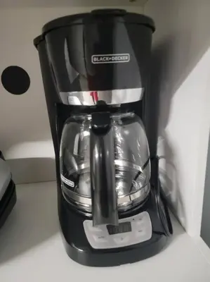a black coffee maker sitting on a counter at Staycation Studio Apartment, Private kitchen , Washroom, Micro Gym & Free Onsite Parking in London
