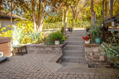 a set of stairs with potted plants on them at Nature Oasis Mar Suite in Dundas